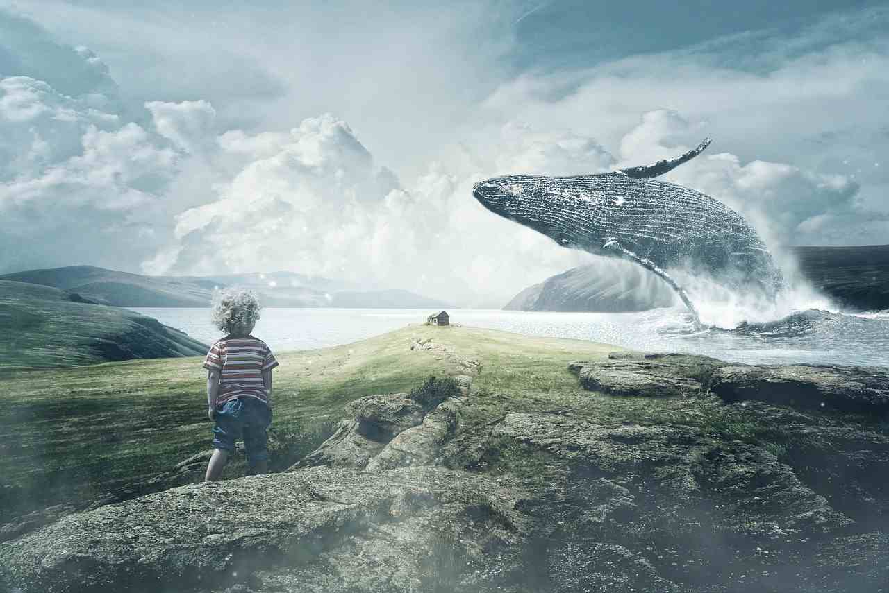 Kleiner Junge am Ufer und großer Wal taucht aus dem Wasser auf - Astrologie zum Jahresende - Vision Neumond in Schütze
