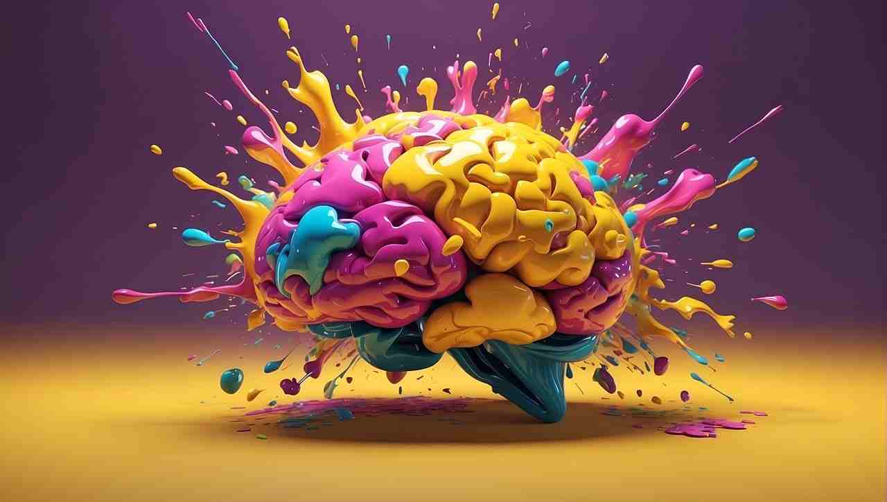 Gehirn in gelb, pink und cyan, explodierende Acrylfarben - KI generiert by geralt @ pixabay.com