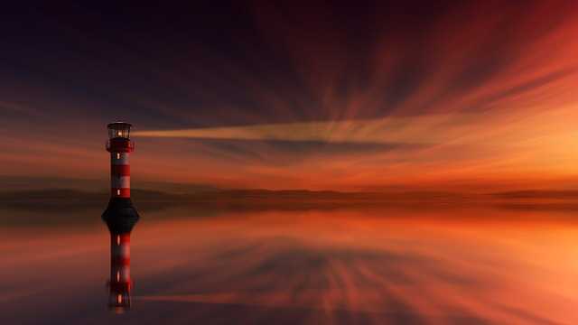 Leuchtturm in strahlendem Sonnenuntergang - Jupiter in Zwilling